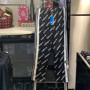 ADIDAS ADI BREAK PANTS WOMENS SIZE M, ADORABLE, will fit a women’s size large.